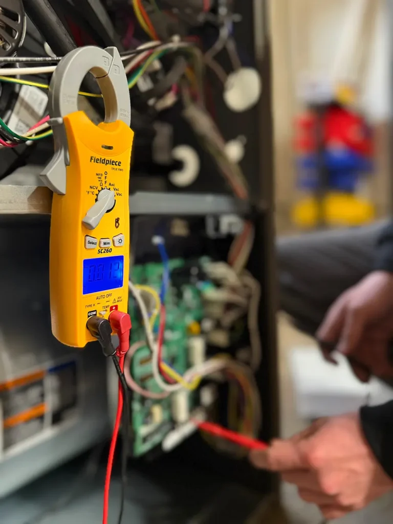 technician performing heating maintenance