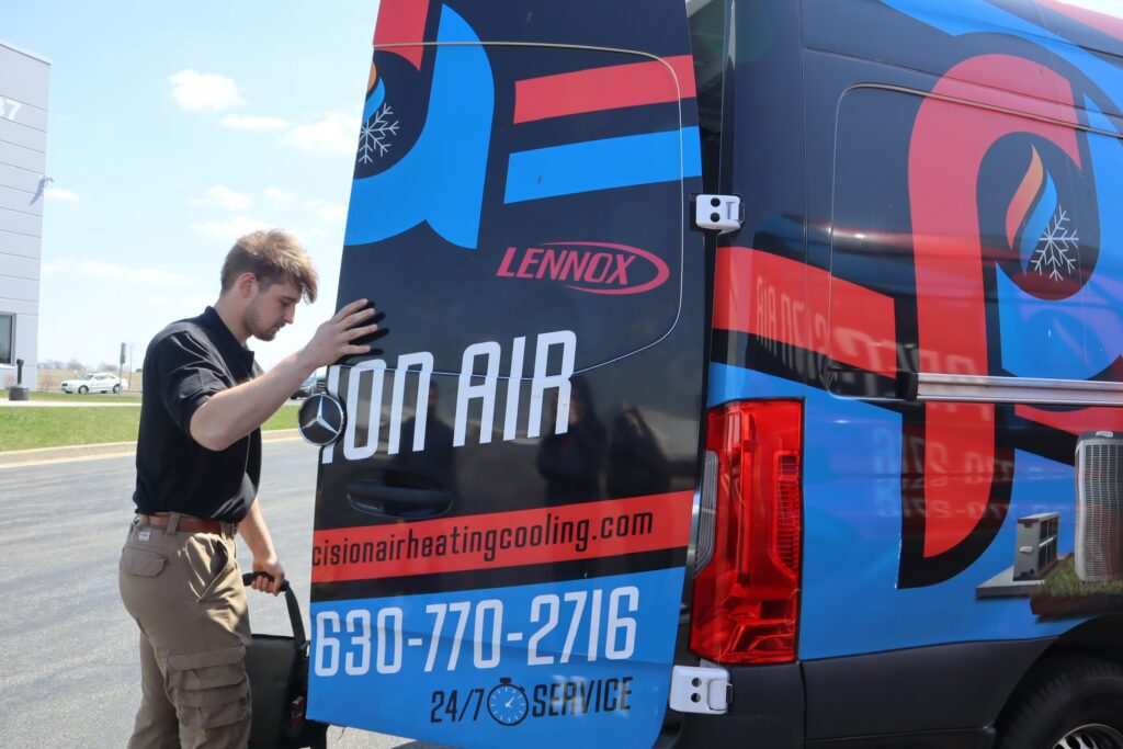 Precision Air HVAC technician getting out of van
