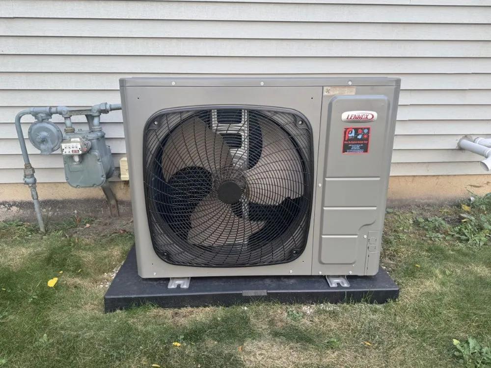 lennox ac unit on the side of a house