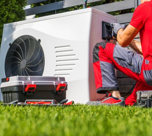 hvac contractor repairing heat pump